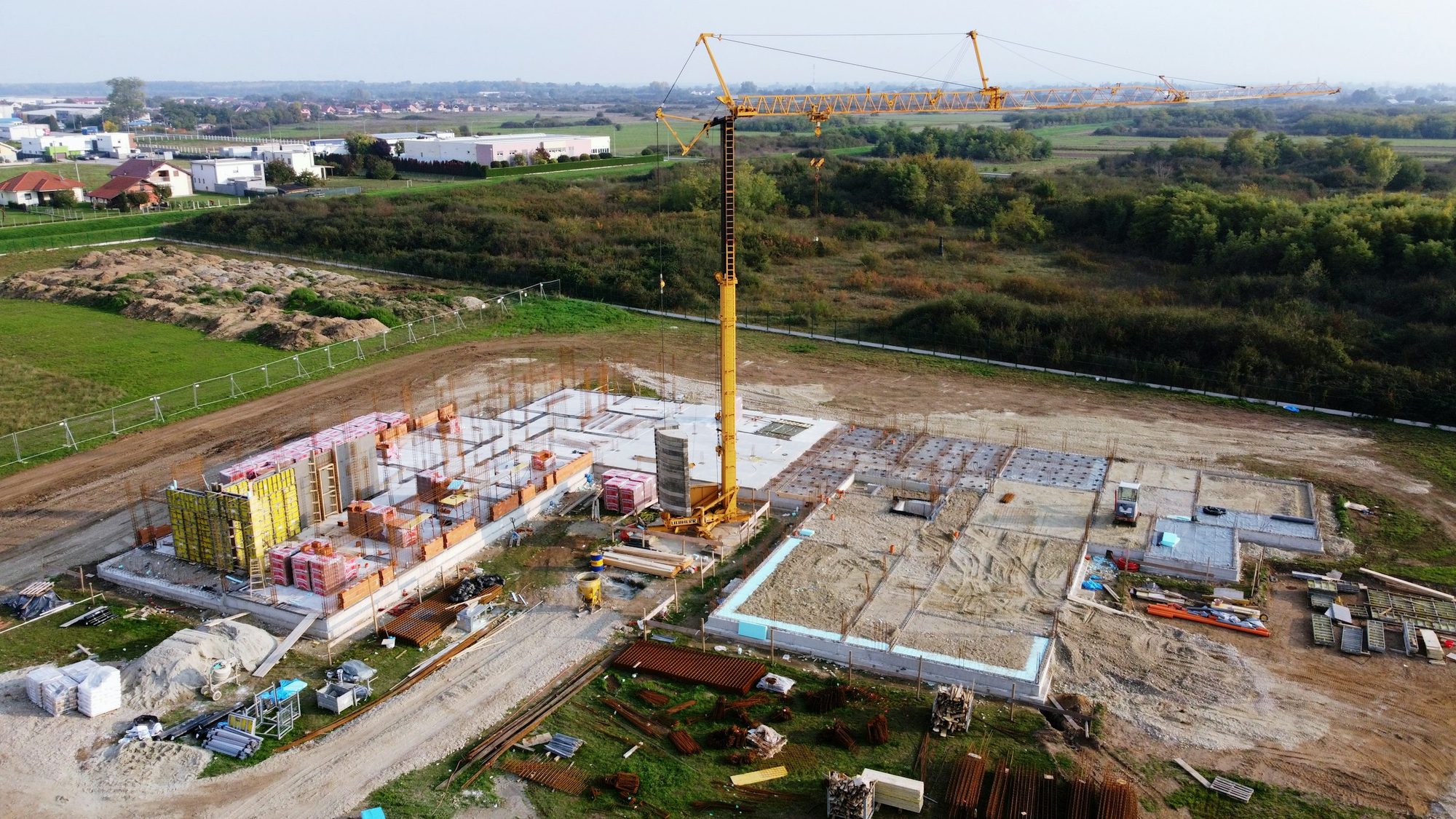 Construction site with crane, aerial view