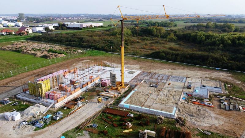 Construction site with crane, aerial view